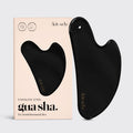 KITSCH stainless steel Gua Sha tool in matte black, designed for facial massage and skincare.