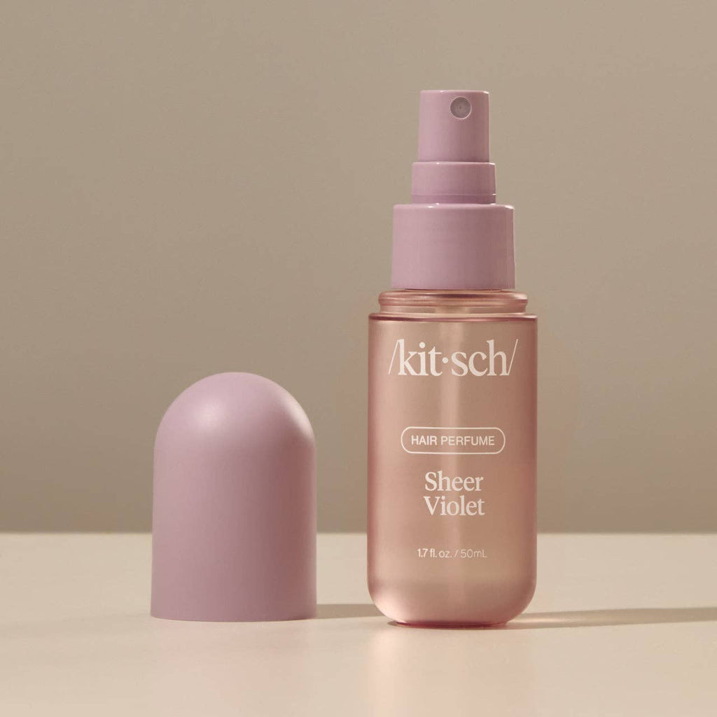 KITSCH Sheer Violet Hair Perfume bottle with purple accents, showcasing elegant packaging and product branding.