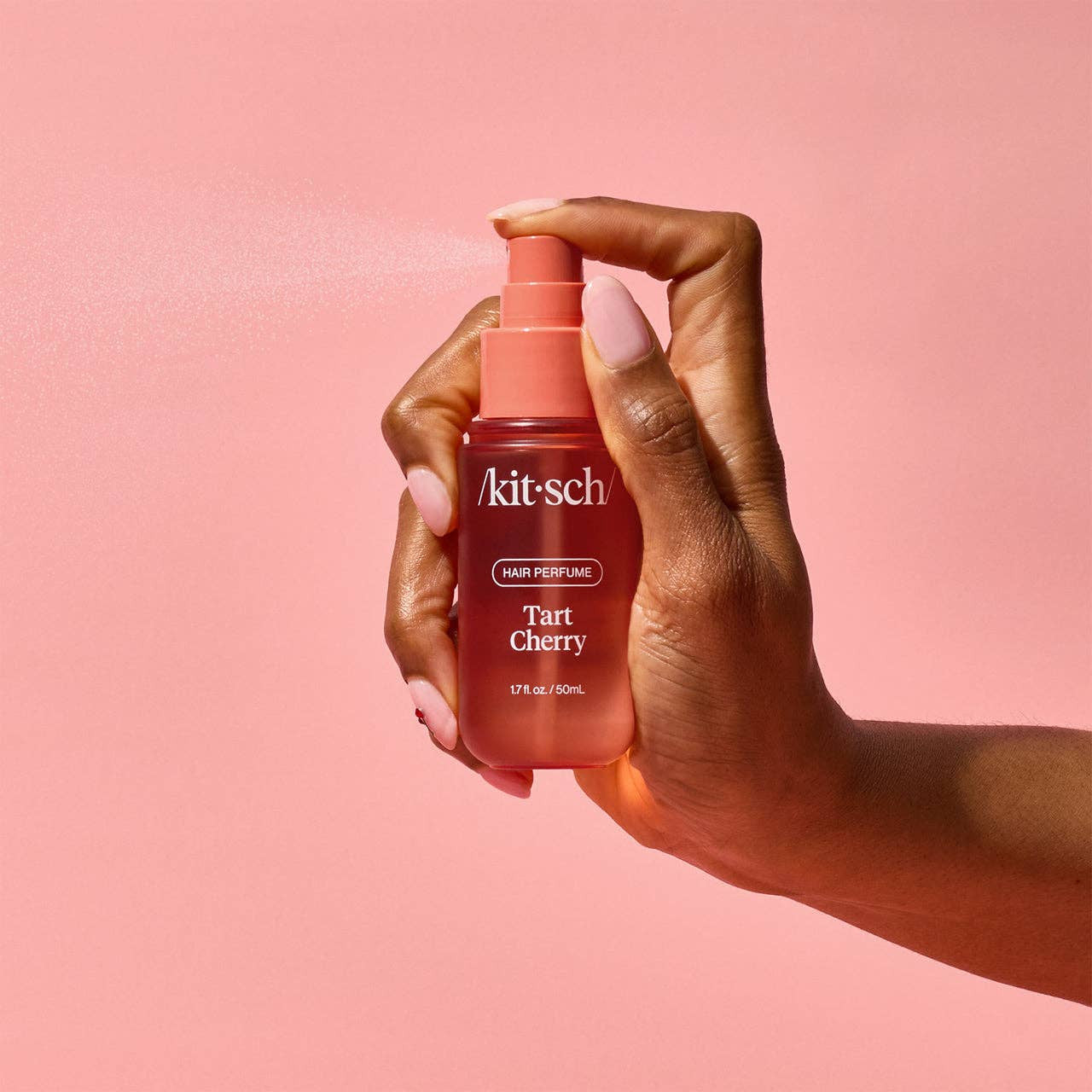 KITSCH Tart Cherry Hair Perfume bottle with cherry-themed label and silver cap, displayed on a neutral background.