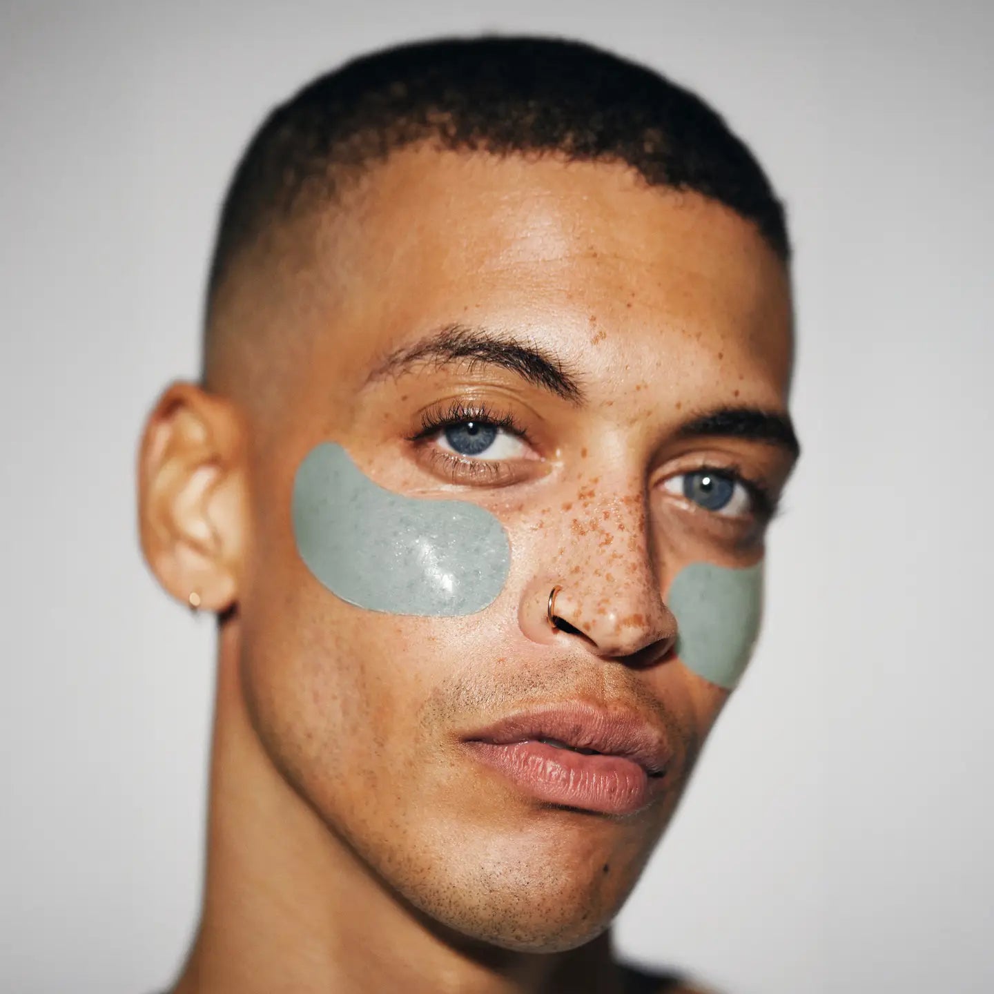 LOOPS Hyper Eyes Dark Spot Hydrogel Eye Mask showing two cooling gel masks with blue and clear sections, designed for eye brightening.