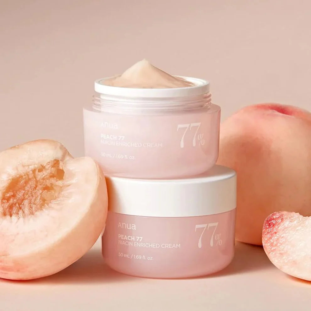 Anua Peach 77 Niacin Enriched Cream 50ml jar with peach-colored lid, showcasing smooth cream inside and fresh peach imagery.
