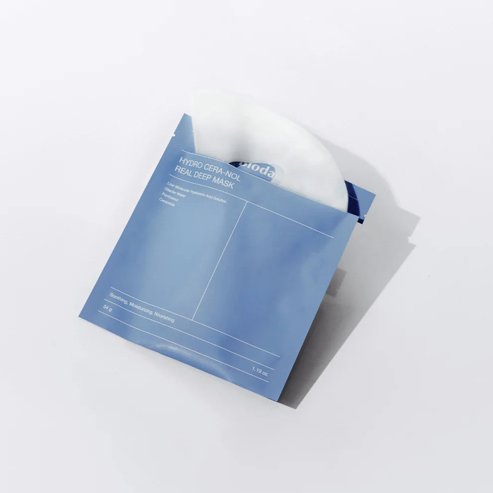 Biodance Hydro Cera-nol Real Deep Mask showing a person applying a hydrating facial sheet mask with a soothing blue design.