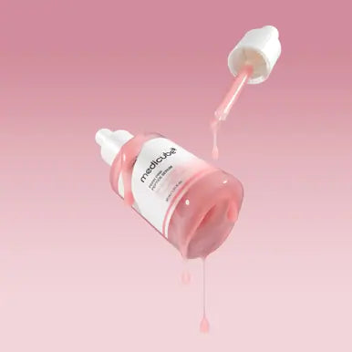 Medicube PDRN Pink Peptide Serum in a 30g pump bottle, showing the sleek pink packaging and serum texture.