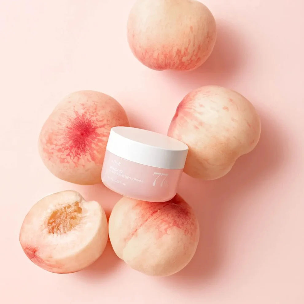 Anua Peach 77 Niacin Enriched Cream 50ml jar with peach-colored label and a smooth cream texture inside.