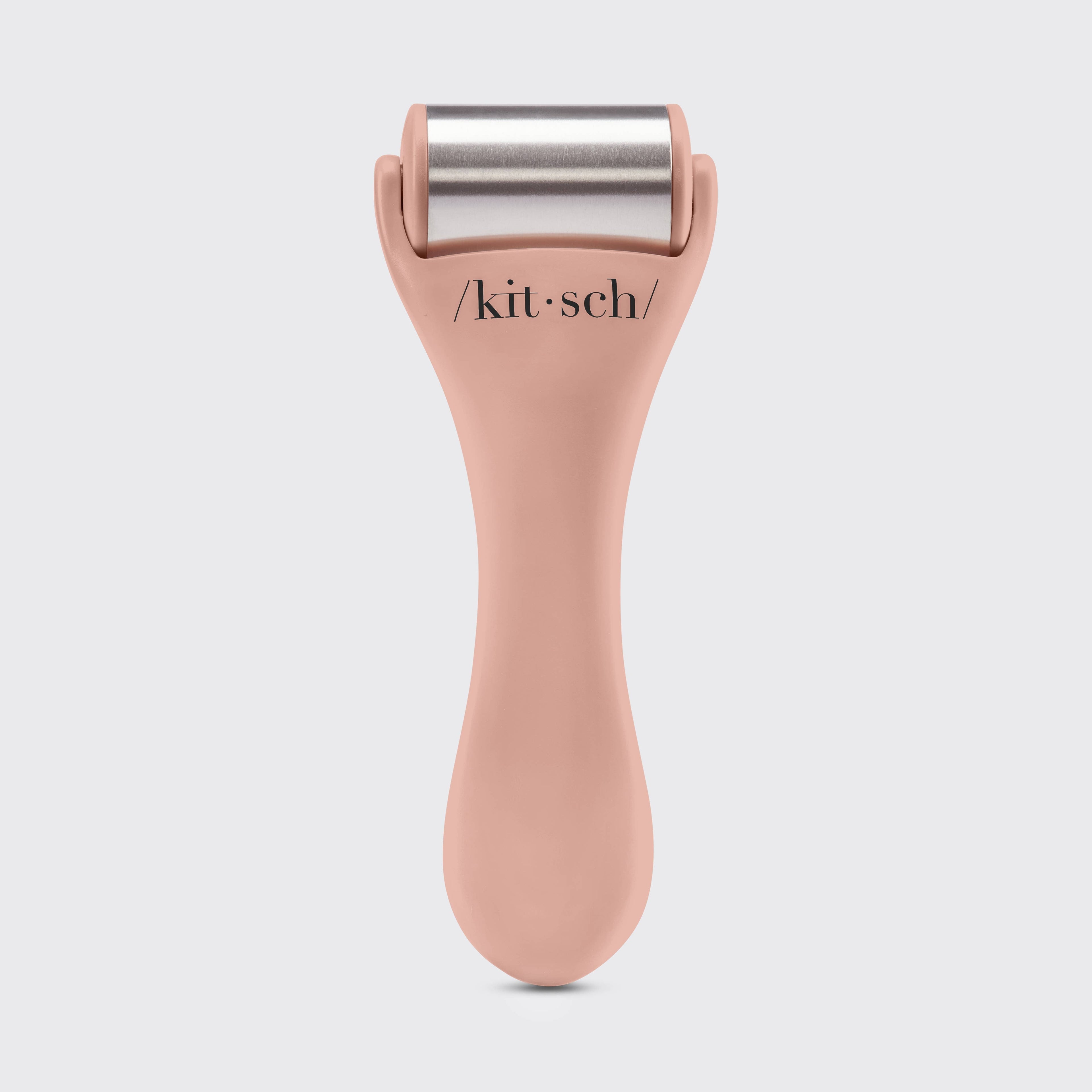 KITSCH ice roller with terracotta handle and stainless steel roller for facial cooling and skin rejuvenation.
