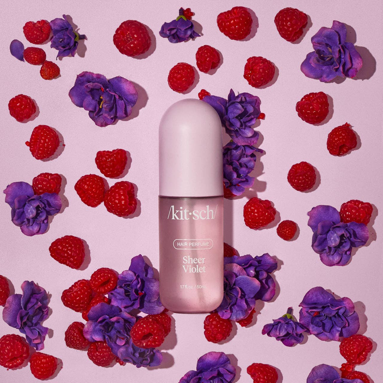 KITSCH Sheer Violet Hair Perfume bottle with floral and violet design, showcasing elegant packaging for hair fragrance.