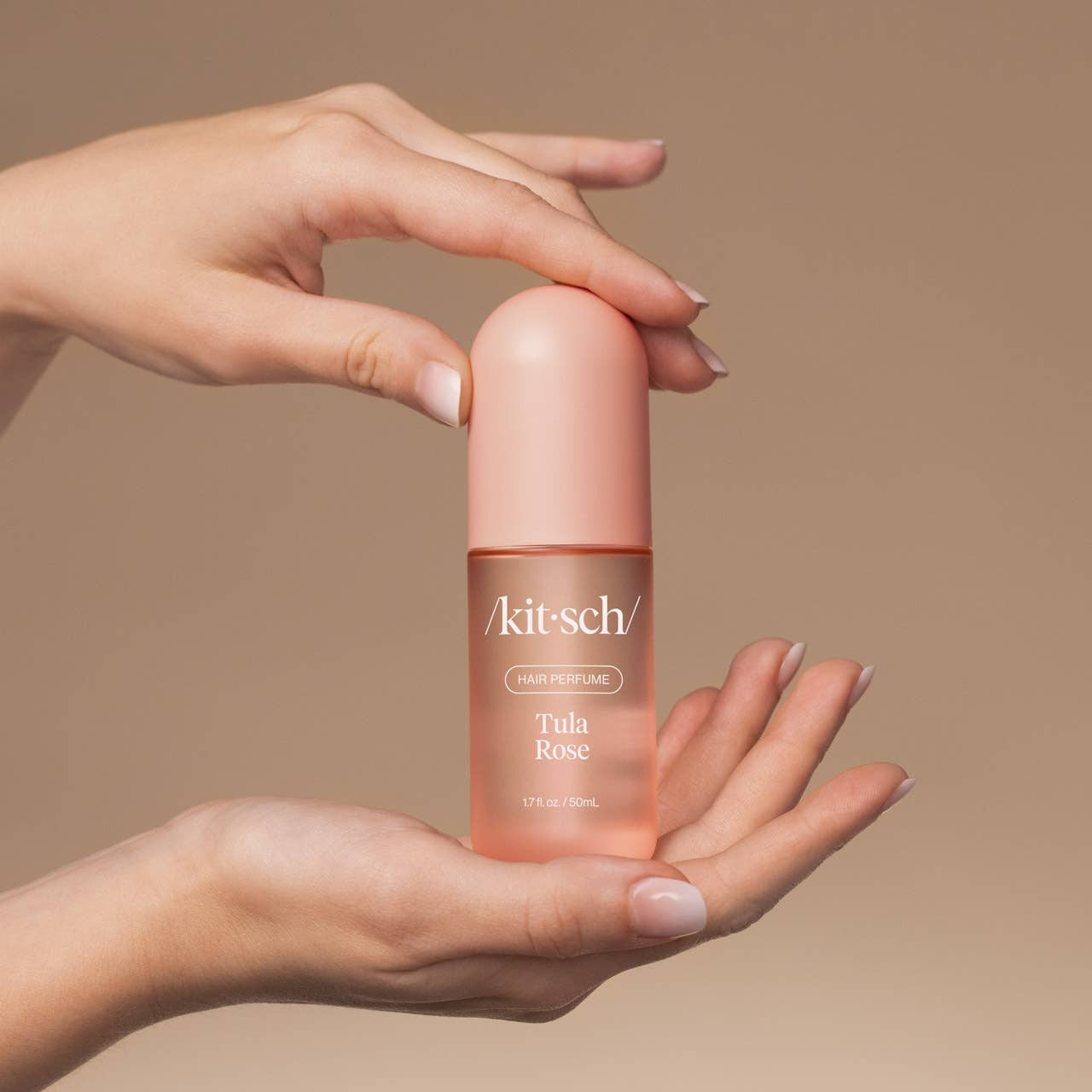 KITSCH Tula Rose Hair Perfume bottle with floral label and pink cap, designed for refreshing and scenting hair.