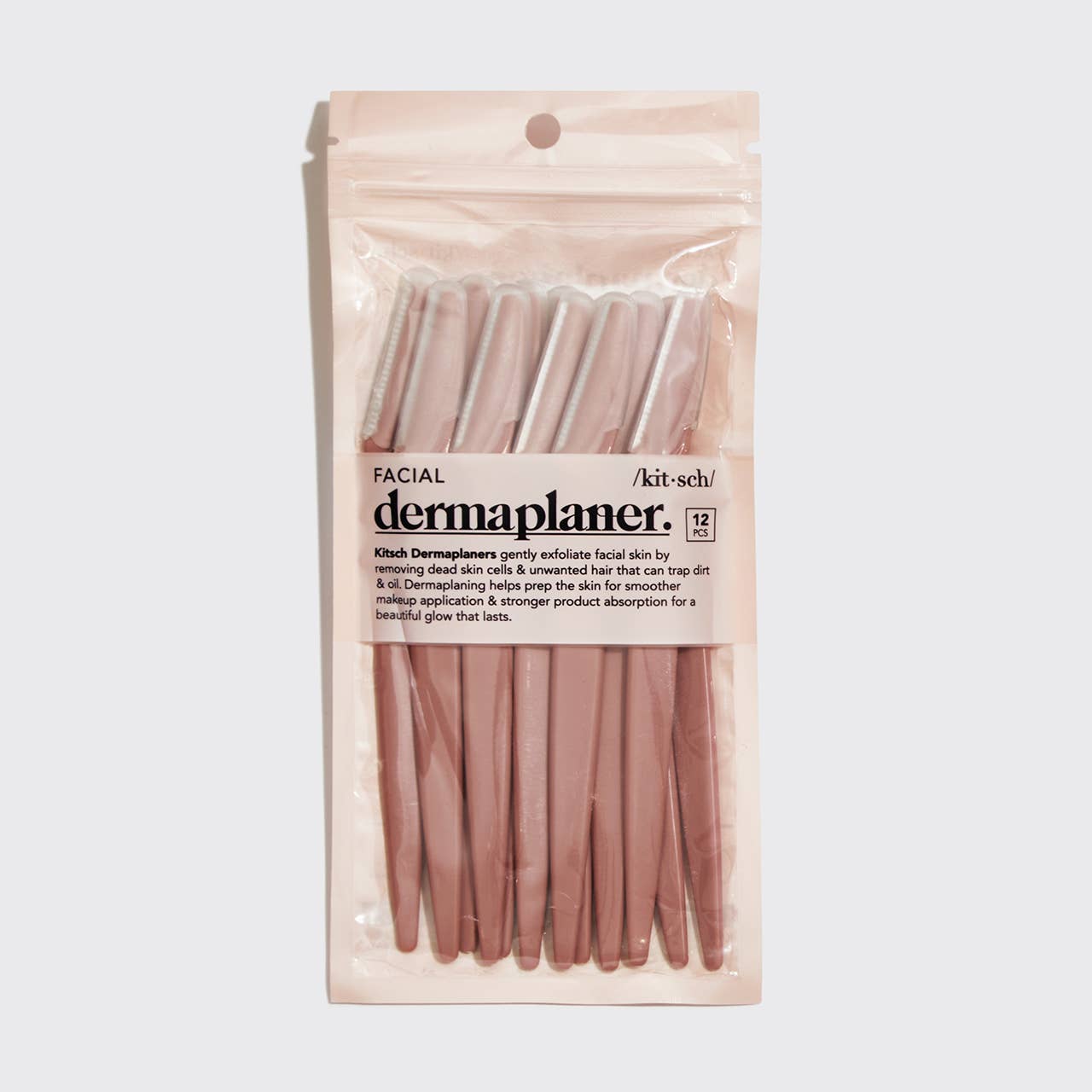 KITSCH eco-friendly dermaplaner 12-pack in terracotta color, featuring stainless steel blades for facial hair removal and exfoliation.