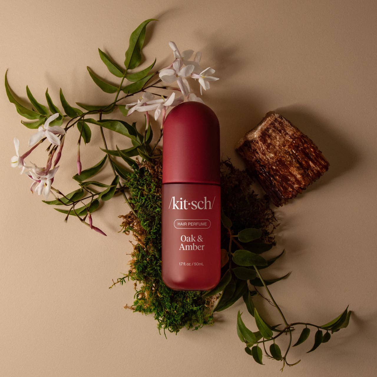 KITSCH Oak & Amber Hair Perfume bottle with amber-colored liquid and elegant packaging, designed to add a subtle scent to hair.