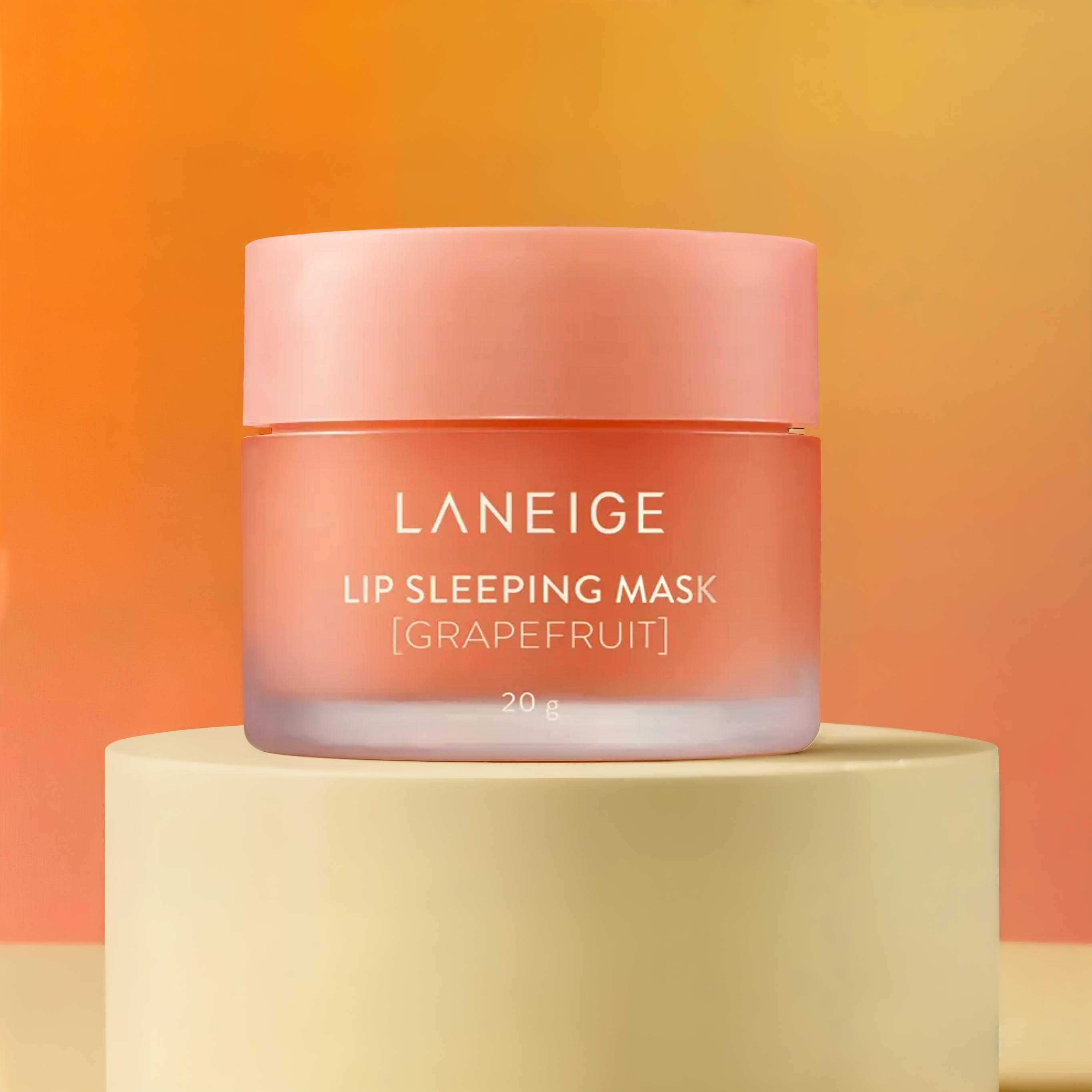 Laneige Lip Sleeping Mask with Vitamin C and grapefruit, showing the jar and fresh grapefruit slices on a white background.