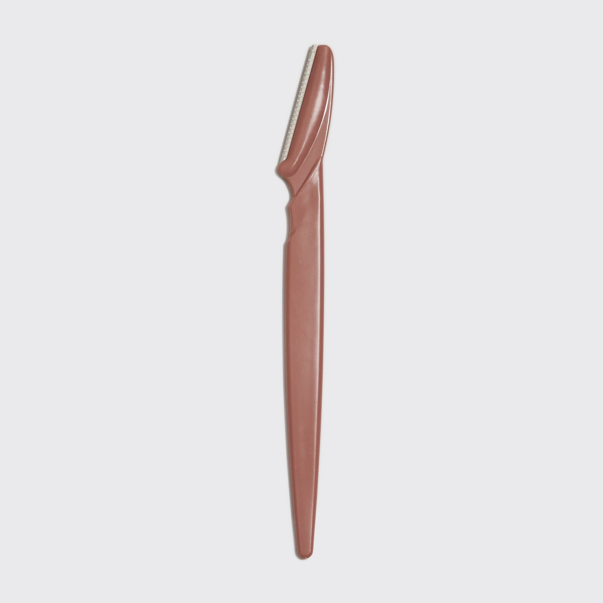 KITSCH eco-friendly dermaplaner 12-pack in terracotta color, featuring reusable blades for gentle facial exfoliation.