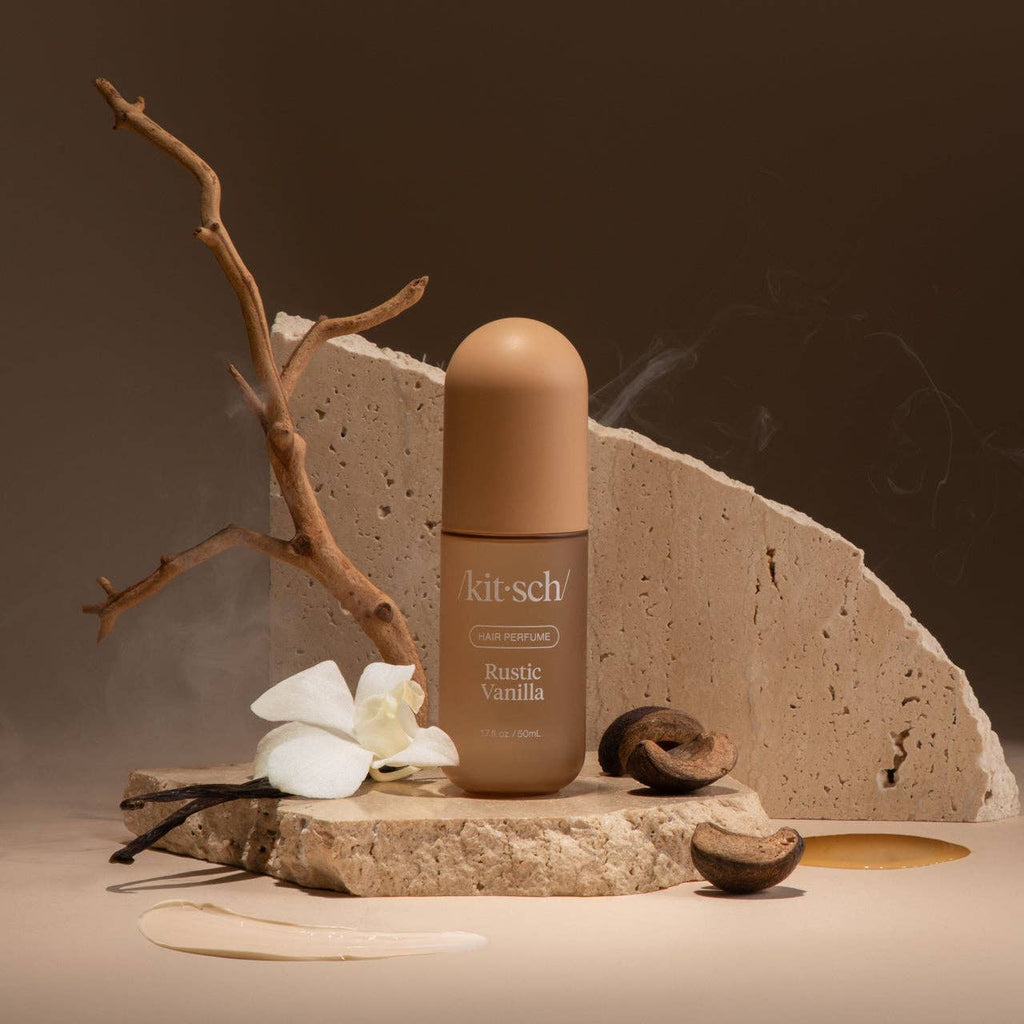 KITSCH Rustic Vanilla Hair Perfume bottle with clear glass and rustic vanilla scent label, styled on a neutral background