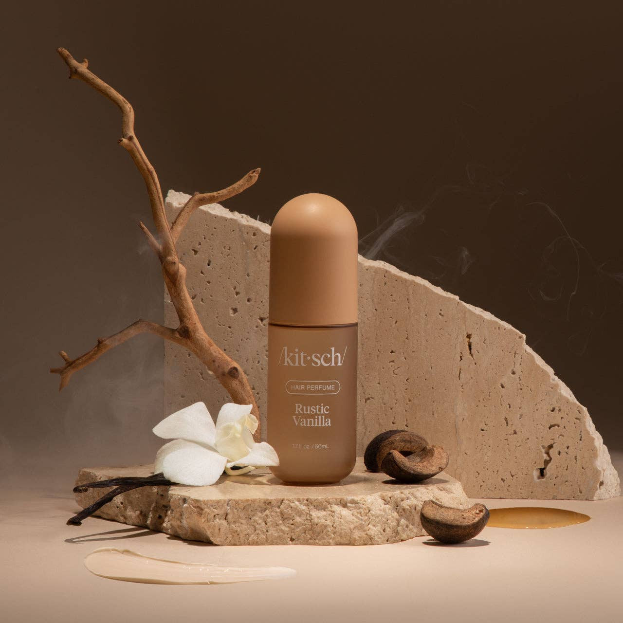 KITSCH Rustic Vanilla Hair Perfume bottle with clear glass and rustic vanilla scent label, styled on a neutral background