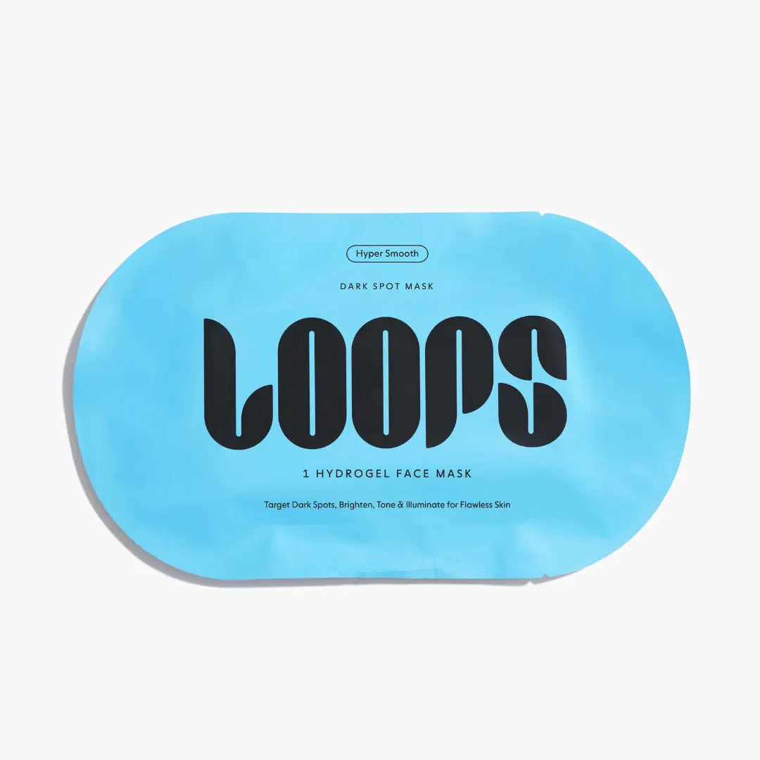 LOOPS Weekly Reset dark spot sheet mask on face, hydrating skincare treatment for even skin tone and brightening effects.