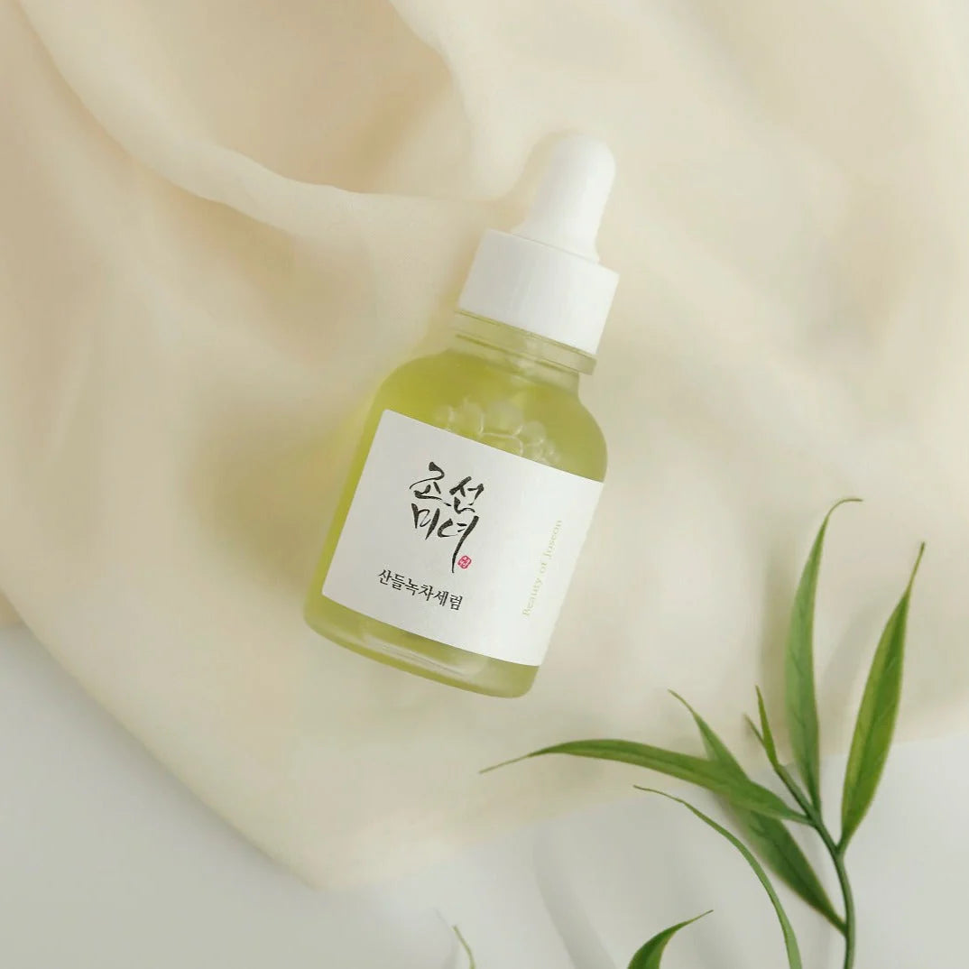 Beauty of Joseon Calming Serum with green tea and panthenol in a 30ml bottle, shown with the serum's green-tinted liquid and packaging.